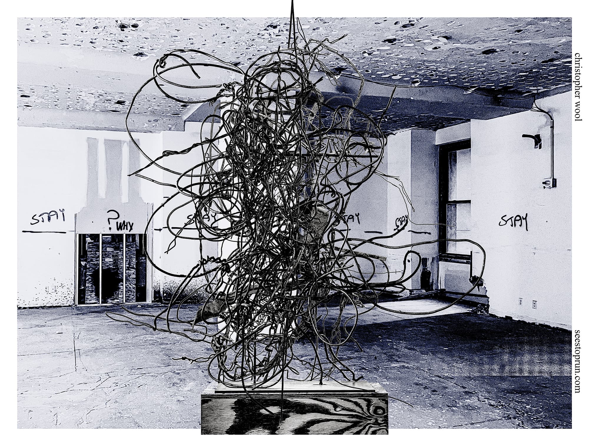 A two-tone image of a horizontally oriented exhibition poster. A black and white wire sculpture sits on a plywood pedestal in front of an interior corner space seemingly under construction. Spray painted on the wall are the words “stay” and “why?”. The background has been digitally colored blue.